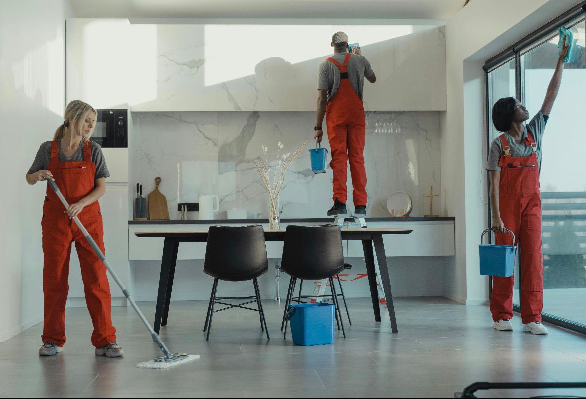 Professional cleaning team working in a luxury home